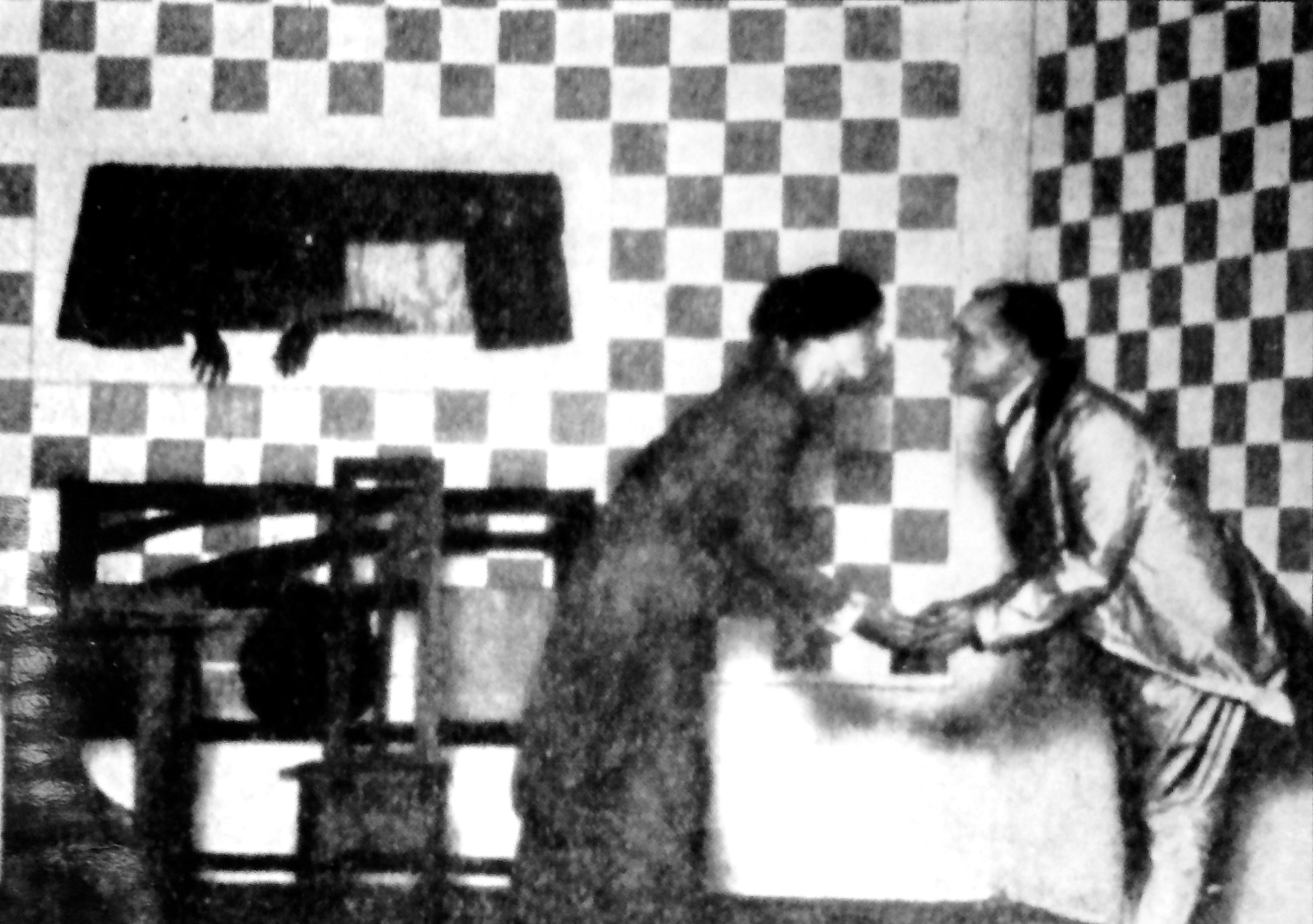 Mina Loy and Williams holding hands and bowing to each other on checkerboard set of Lima Beans