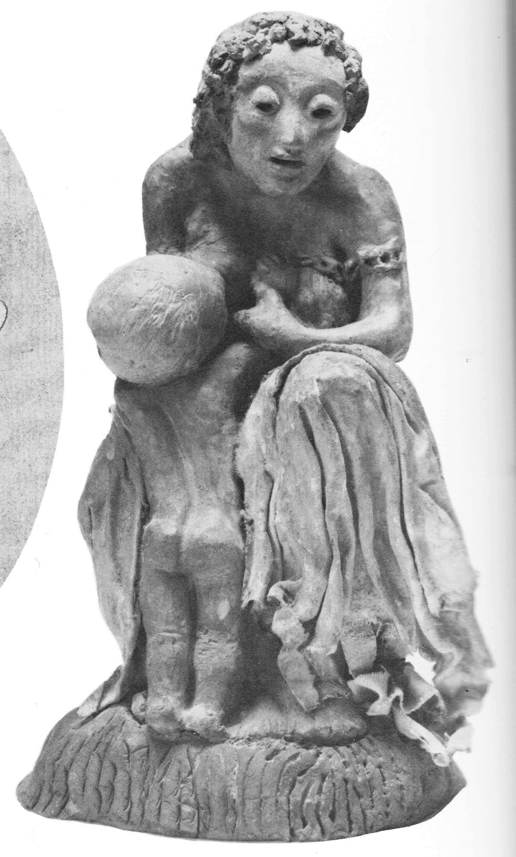 sculpture of a seated mother nursing a kneeling child